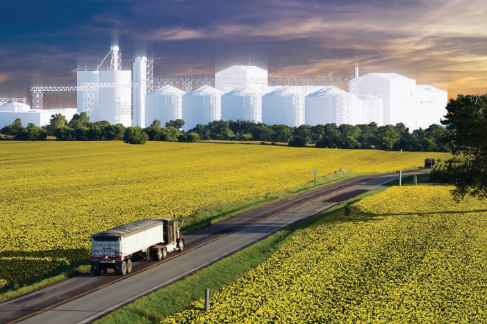 A truck driving on a highway with flowering fields on either side, a 3D rendering of a crush facility on the horizon
